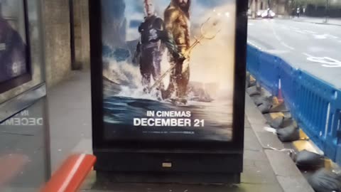 Aquaman Waiting at a Bus Stop