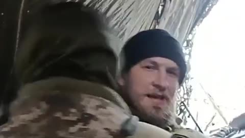 A Ukrainian serviceman demonstrates a shooting fight with Russian fighters. 2