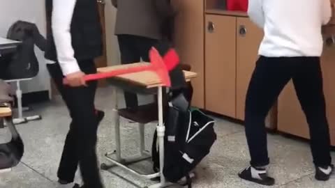 Korean students have fun knocking on their desks.