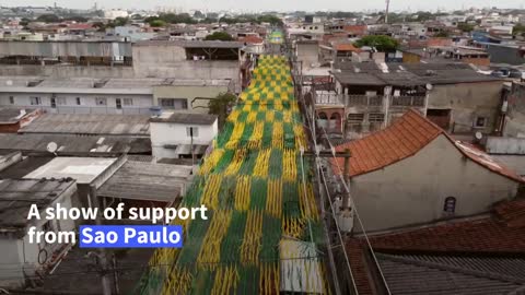 Brazilians turn Sao Paulo streets yellow and green ahead of World Cup