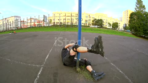 Man roller skating hitting a pole. Time lapse and slow motion finally.