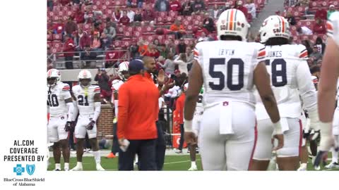 Cadillac Williams takes the field for warmups ahead of the Iron Bowl; shakes hands with Nick Saban