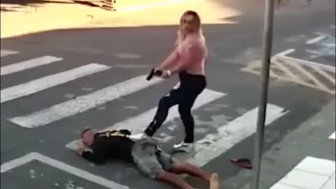 a woman saves a child from a kinaping in broad daylight.