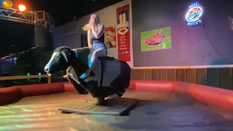 LADY BULL RIDING LIKE A PROFESSIONAL RIDER