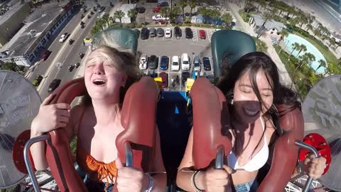 Funny gorgeous girl slingshot ride.