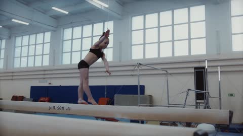 A Little Girl Balancing at the Beam