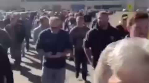 Group of workers walk off the job