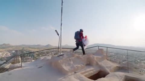 French athlete Valentin Delluc paragliding over breathtaking Capadocia, Turkiye