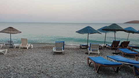 Beach Bed And Chairs Lined Up In The Sea Shore