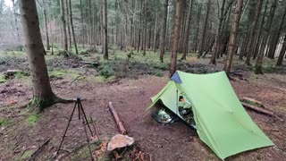 GoPro walking towards camp in the woods