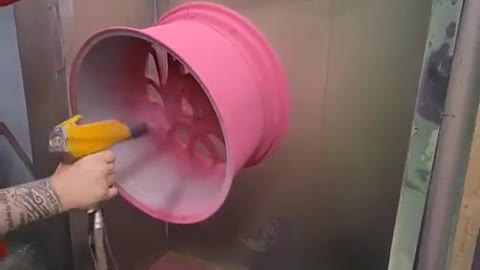 A pink wheel hub for car repair.