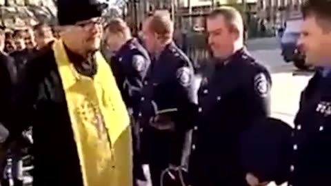 PRIEST BLESSING POLICE OFFICERS