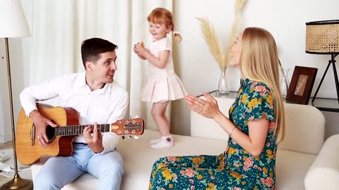 Happy family singing and dancing