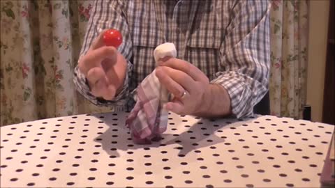 A Coloured Ball Passes Right Through A Hankerchief