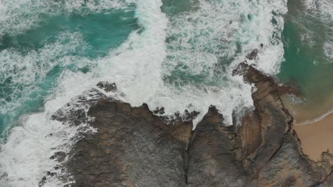 relaxing waves breaking against the shore