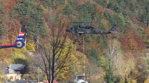 Military helicopters fight with forest fire