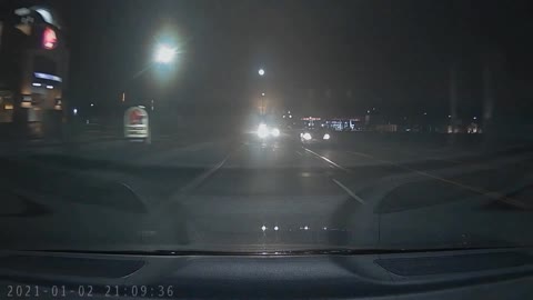 Crazy driver blows through red light