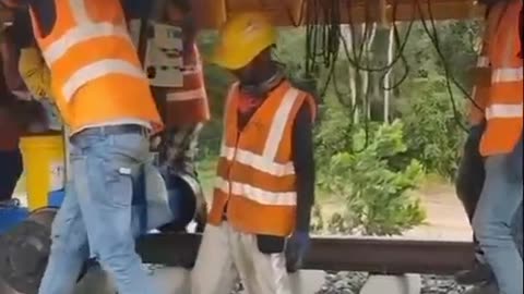 Making railway track by heavy machinery