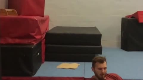 Guy black sweats red shirt backflip wall push fail