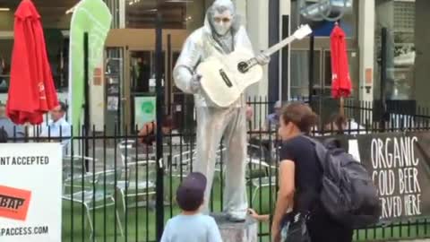 Silver Elvis and a little boy.... Cool!!!!!!