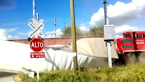 Truck Crosses Train Track at the Worst Possible Time