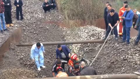 Race To Rescue Workman Buried Up To Neck In Gravel