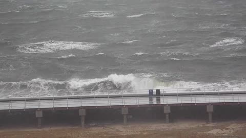 Waves Breaking Through The Bridge