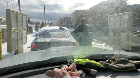 Canadian Clears Off Snow Covered Car