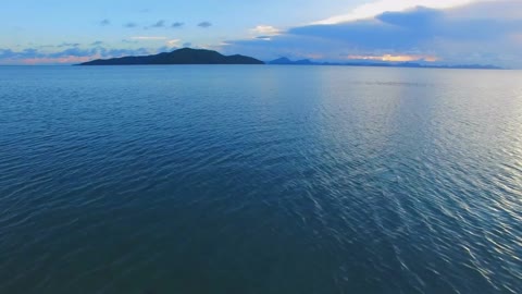 flight above the sea aerial view of the ocean in thailand hi speed motion