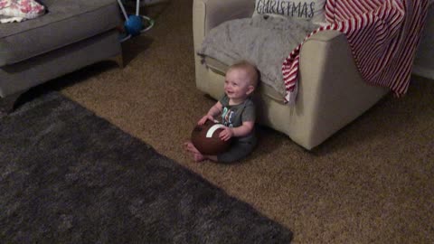 Giggling Baby Finds Daddy's Football Noises Hilarious