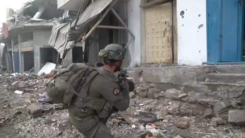 Frames of urban battles of Israeli infantry and tanks in Shejaiya