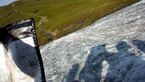 Crazy slide off mountain using map of Carpathian mountains as sledge