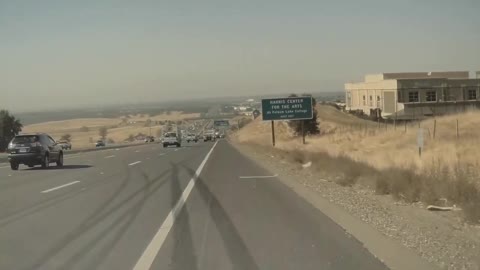 Unsecured Ladder Bounces Along Freeway