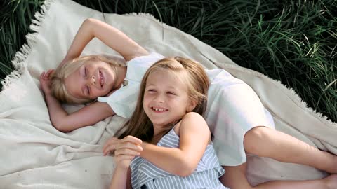 Two Pretty Girls Lying on the Picnic Blanket😊