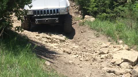 Grand Cherokee dropping down a rock wash Tuttle ORV