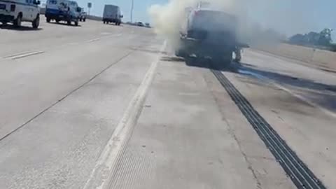 Fireman Extinguish Car That Caught Fire on Tow Truck