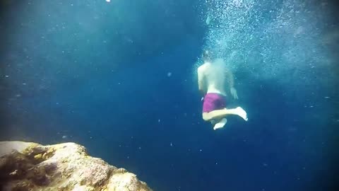 Young men dive into the depths