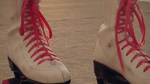 Roller skates of a girl when skating on the street