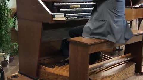 Erikson plays organ at Warner Hall, Royal Palm Presbyterian Church