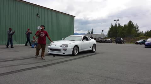 Smoke Clouds Erupt from Sports Car Burnout