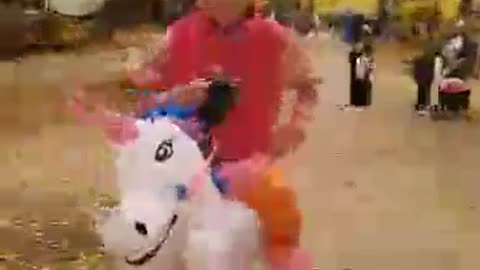 Slow mo man riding his unicorn