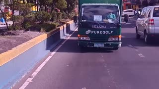 Truck Seemingly Drives in Reverse Down Street