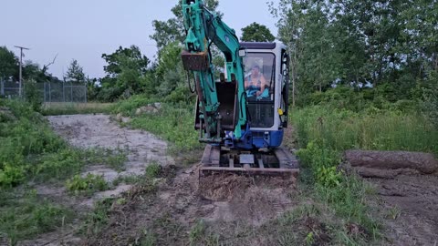 IHI 35NX making a roadway in the woods