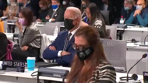 Biden falls asleep at COP26 'climate change' conference and is awakened by a handler.😂