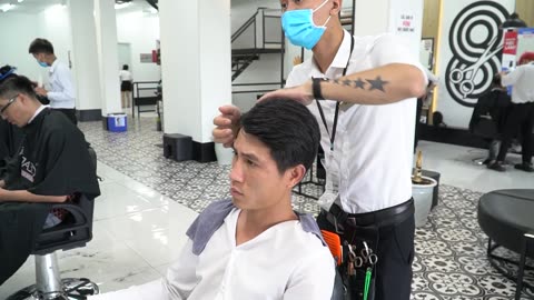 Beautiful girl washing her hair at a cheap massage in Danang Vietnam