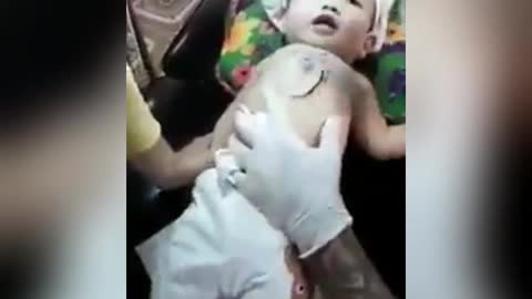 Baby gets ink tattoo from parents