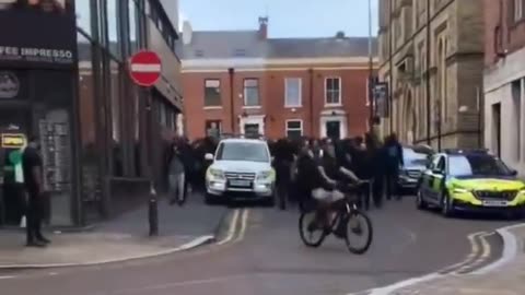 A large group of men marched through the streets of Blackburn