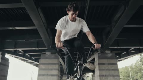 Man Doing a Stunt with His Bike