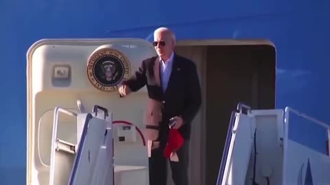 Biden is seen with another red hat a day after putting on Trump hat.