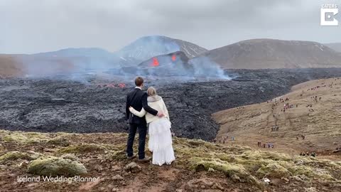 Couple Take Engagement Pictures In Front Of Active Volcano